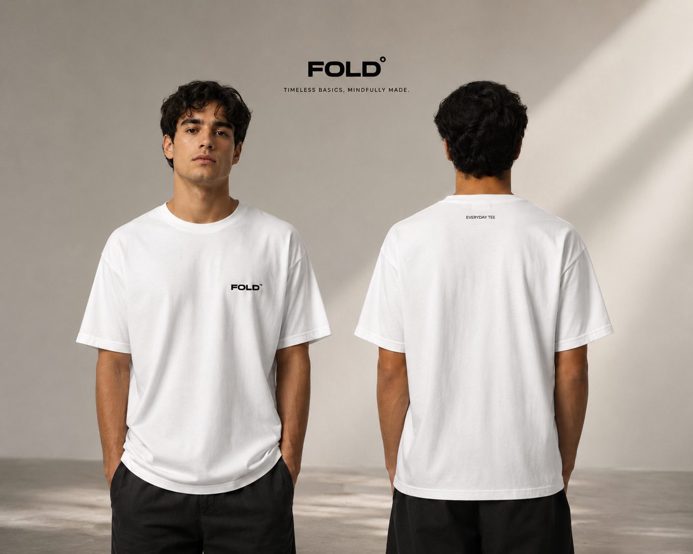 Two models wearing the FOLD Everyday Tee in white, shot from the front and back